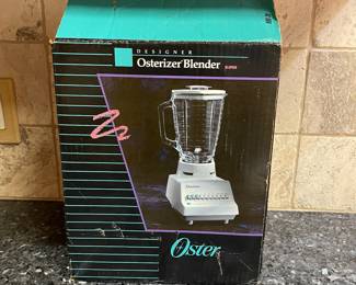 R76 - $30. Vintage Osterizer Blender. Never used. Removed from box for photos.