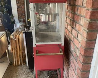 R15 - $50. "Funtime" Popcorn Maker Model FT860CR/UE40010. Has some sun fading and needs a good cleaning! Has been stored on a screened in porch / covered.