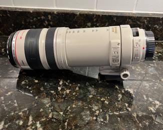 C40 - $400. Canon EF 100-400mm f/4.5-5.6L IS USM.  Missing lens cap, has lens filter over lens instead. 