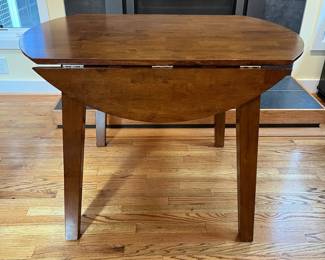 C15 - $75. Kitchen Table with small drop leaves. Leaves down it measures 42.25” wide x 30” deep 30.5” tall. Each leaf adds 7.25". 