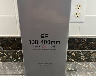 C40 - $400. Canon EF 100-400mm f/4.5-5.6L IS USM.  Missing lens cap, has lens filter over lens instead. 
