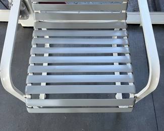 C28 - $350. Woodard Furniture Glass Top Table & 4 Vinyl Strap Chairs. Measures 47.5" round x 28" tall. Chairs are 23.5" x 25.5" x 36" tall. Has been used on a screened in porch - a few very minor rust spots