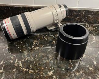C40 - $400. Canon EF 100-400mm f/4.5-5.6L IS USM.  Missing lens cap, has lens filter over lens instead. 