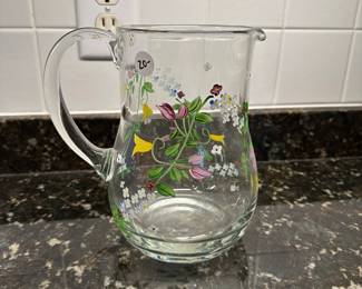 C99 - $20. Handpainted glass pitcher. 