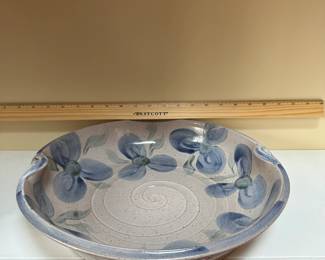 C57 - $25. Pottery Bowl with floral pattern. 
