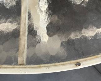 C28 - $350. Woodard Furniture Glass Top Table & 4 Vinyl Strap Chairs. Measures 47.5" round x 28" tall. Chairs are 23.5" x 25.5" x 36" tall. Has been used on a screened in porch - a few very minor rust spots