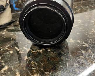 C40 - $400. Canon EF 100-400mm f/4.5-5.6L IS USM.  Missing lens cap, has lens filter over lens instead. 