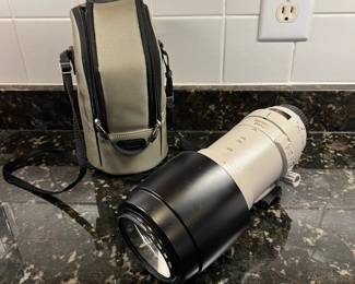 C40 - $400. Canon EF 100-400mm f/4.5-5.6L IS USM.  Missing lens cap, has lens filter over lens instead. 