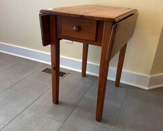 C9 - $35. Small Pine Side Table. Leaves down it measures 17” wide x  24” deep x 26 tall. Each leaf adds 7.25".