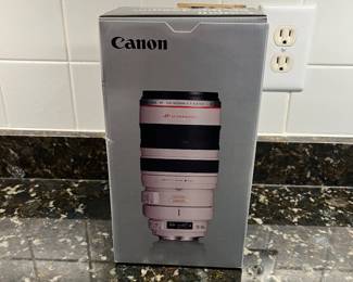 C40 - $400. Canon EF 100-400mm f/4.5-5.6L IS USM.  Missing lens cap, has lens filter over lens instead. 