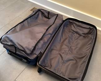 C74 - $40. Blue Eddie Bauer Expedition 26 Rolling Duffel Bag. In very good used condition. Zippers all work - lots of storage. 