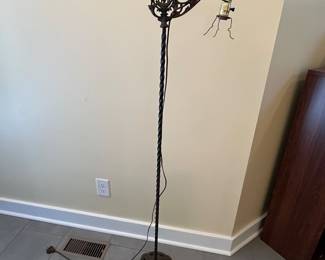 C25 - $40. Iron Floor Lamp. Probably needs rewired. Measures 56.5" tall. Has ship design on the top arm. 