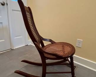 C5 - $40. Single Caned Antique Childs Rocking Chair (from the mid 1800s). Seat is in very good condition - Back has holes. Measures 19” wide x 29.25”deep x 34.25” tall 