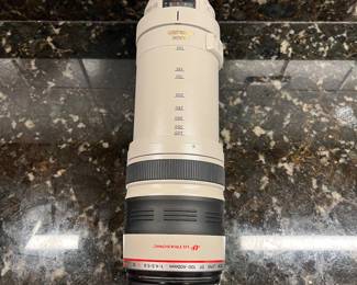 C40 - $400. Canon EF 100-400mm f/4.5-5.6L IS USM.  Missing lens cap, has lens filter over lens instead. 