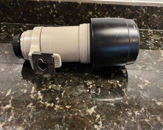 C40 - $400. Canon EF 100-400mm f/4.5-5.6L IS USM.  Missing lens cap, has lens filter over lens instead. 
