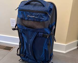 C74 - $40. Blue Eddie Bauer Expedition 26 Rolling Duffel Bag. In very good used condition. Zippers all work - lots of storage. 