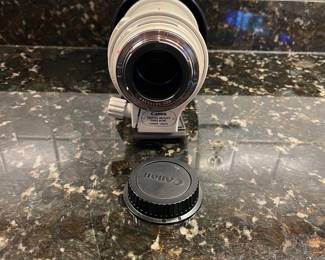 C40 - $400. Canon EF 100-400mm f/4.5-5.6L IS USM.  Missing lens cap, has lens filter over lens instead. 