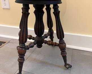 C10 - $65. Piano Stool with glass feet. Adjustable height. Seat Measures 14.75” wide x 19” tall all the way down. Seat is 2 layers and needs glued back together. 