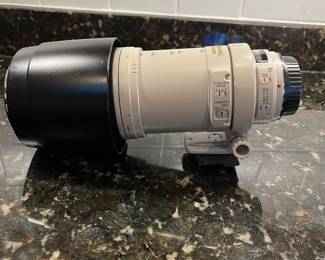 C40 - $400. Canon EF 100-400mm f/4.5-5.6L IS USM.  Missing lens cap, has lens filter over lens instead. 