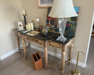 Decor, there is a pair of the glass lamps, stone topped console $100