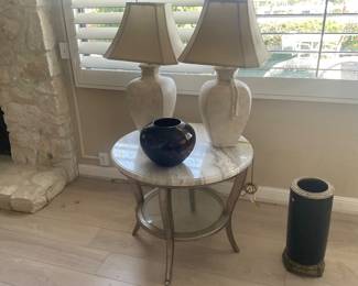 Pair of lamps $20, raku pottery $20 stone topped table $50