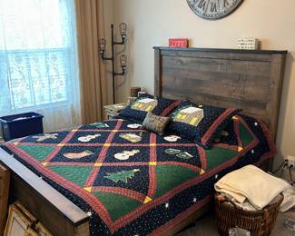 Queen bed, quilt, wall clock
