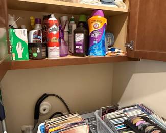 Assorted Household Cleaning Supplies and Media Collection