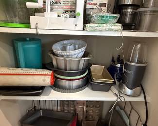 Assorted Baking Pans, Atlas Pasta Maker, NutriBullet Blender, and Philips Saeco Coffee Machine