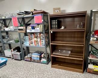 file cabinet, puzzles, picture albums, glassware, journals