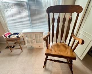 wood rocker, white wall cabinet