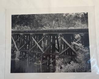 Black and White Photograph of a Wooden Railroad Trestle Bridge by Carson Boone