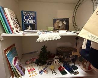 Collection of Cat-Themed Books, Framed Art, and Holiday Decor