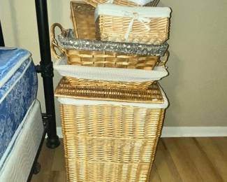 SEVERAL LINEN-LINED BASKETS
