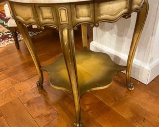 Vintage gold painted side table with carved apron and round marble top.