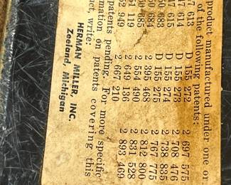 Mid-century molded fiberglass shell chair with metal legs in blue/gray finish.