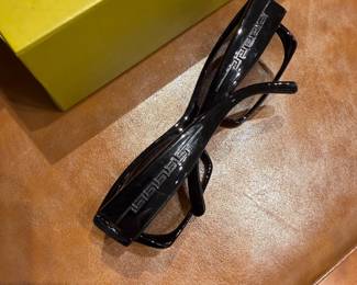 Black rectangular logo sunglasses with bold side branding.