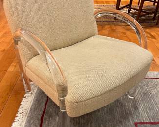 Postmodern Acrylic Armchair with Curved Lucite Frame and Neutral Upholstery.