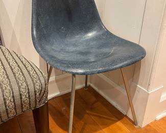Mid-century molded fiberglass shell chair with metal legs in blue/gray finish.