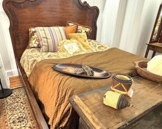 A large carved wooden headboard bed in traditional European provincial style, likely French or Italian revival furniture, circa 1970s–1990s.