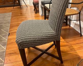 Designer upholstered dining chair with patterned fabric by Donghia.