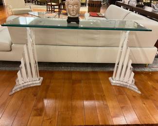 Modern glass console table with sculptural clear acrylic base in Art Deco style.