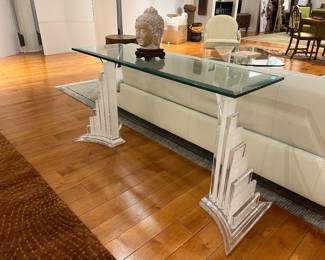Modern glass console table with sculptural clear acrylic base in Art Deco style.