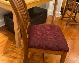 Solid wood mission-style dining chair with slatted back and upholstered burgundy seat.