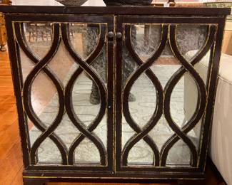 Contemporary Dark Wood Mirrored Cabinet with Decorative Geometric Overlay Doors.