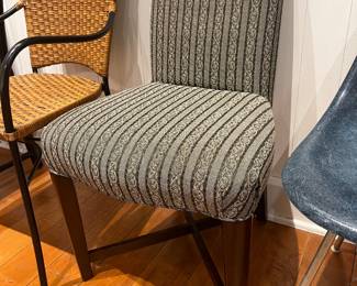 Designer upholstered dining chair with patterned fabric by Donghia.