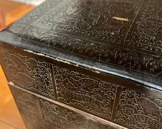 Embossed Decorative Trunk – Vintage style embossed black storage trunk with ornate floral and geometric detailing.