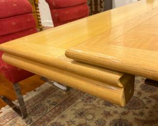 Expandable Mid-Century Oak Dining Table with Pull-Out Leaves and Pedestal Base.