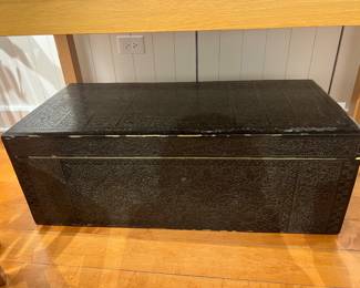 Embossed Decorative Trunk – Vintage style embossed black storage trunk with ornate floral and geometric detailing.