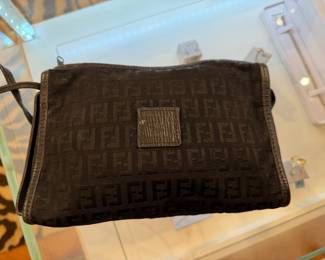 Fendi brown monogram canvas clutch pouch with FF logo pattern.
