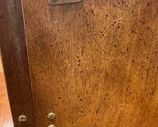 A mid-20th-century (1950s–60s) American china/display cabinet with Asian-influenced geometric brass trim and walnut/pecan veneer.